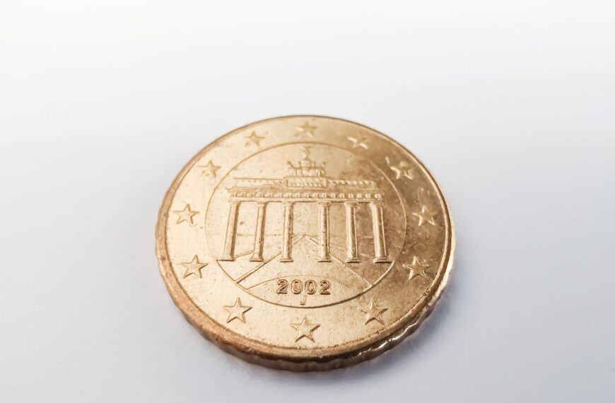 A detailed view of a 2002 Euro coin featuring the Brandenburg Gate, emphasizing currency and design.