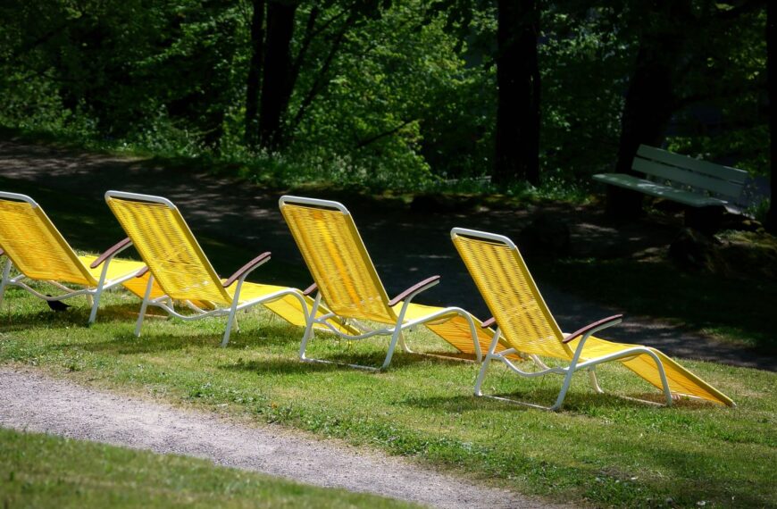 Bright yellow lounge chairs in a peaceful park setting in Bad Wildbad, Germany.